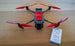 Image of a DJI Mavic Pro drone with red propellers and a package of reflective tape for bird protection.
