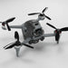 DJI FPV drone with upgraded black propellers, showcasing advanced design and features for high-performance flight.