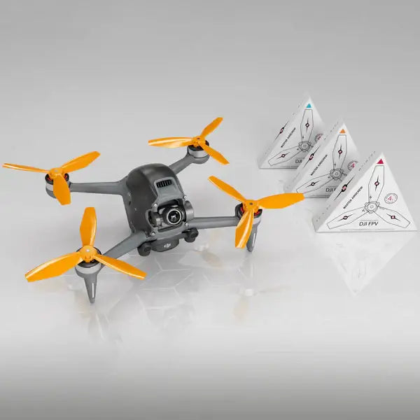 DJI FPV drone with orange propellers and three triangular instruction pyramids for enhanced flight performance.