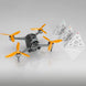 DJI FPV drone with orange propellers and three triangular instruction pyramids for enhanced flight performance.