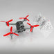 DJI FPV drone with red propellers and three obstacle avoidance pyramids on a reflective surface.