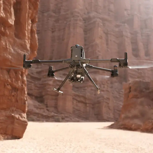 DJI Matrice 400 drone flying through a canyon, showcasing its versatile design and advanced technology.