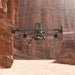DJI Matrice 400 drone flying through a canyon, showcasing its versatile design and advanced technology.