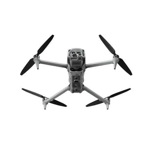 DJI Matrice 4T thermal drone flying overhead with four rotor blades visible.