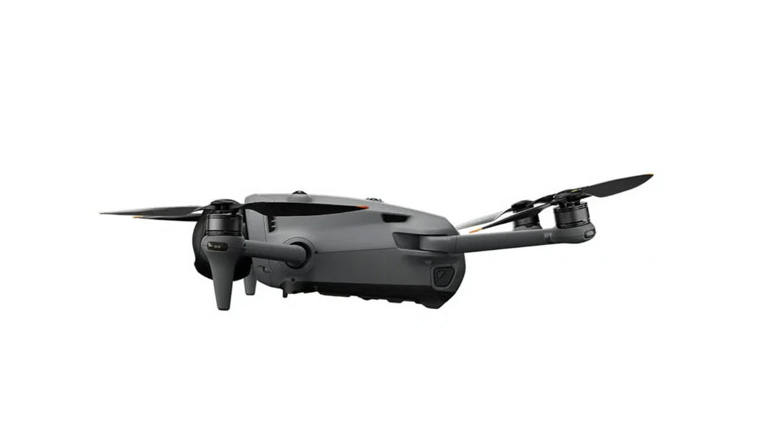 DJI Mavic 4 Pro drone side view with propellers, showcasing sleek design and advanced features.