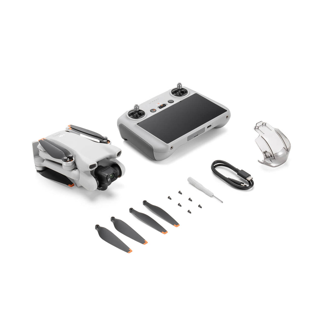 DJI Mini 3 drone and remote controller with accessories including propellers and charging cable.