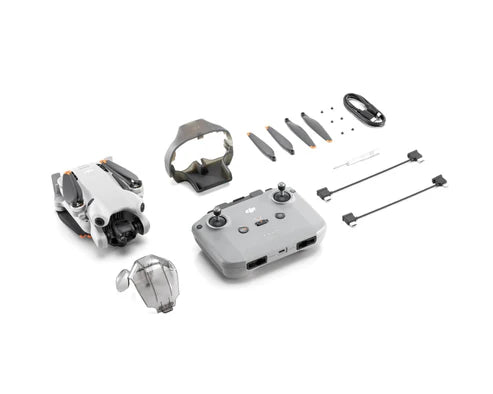 DJI Mini 4 Pro drone with remote controller, propellers, and accessories for aerial photography.