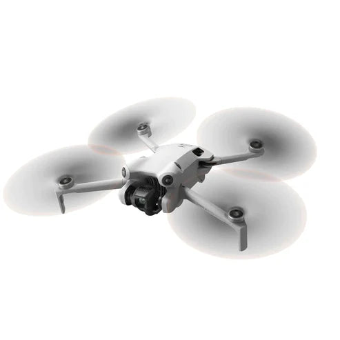 DJI Mini 4 Pro drone with spinning propellers and camera, ideal for advanced imaging and video capture.