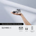 DJI Mini 4K drone in hand, showcasing its compact design for beginners and daily use.