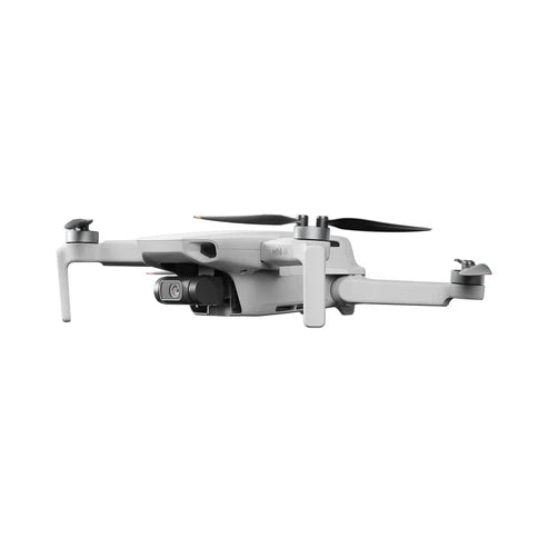 DJI Mini 4K drone in profile view, showcasing its compact design and camera features for easy aerial photography.