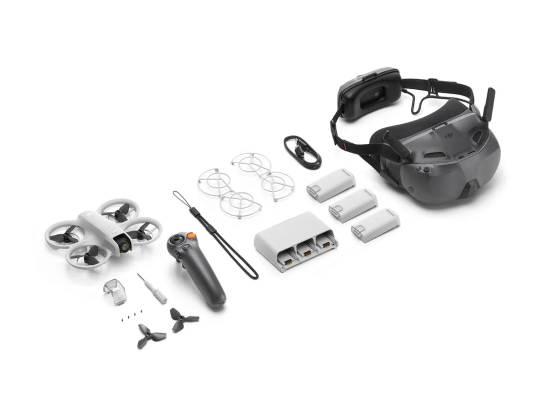 DJI Neo Motion Fly More Combo with drone, controller, batteries, and headset components arranged on a surface.