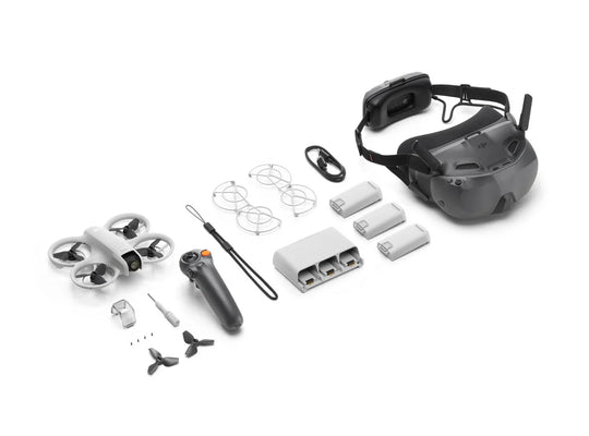 DJI Neo Motion Fly More Combo with drone, controller, batteries, and headset components arranged on a surface.