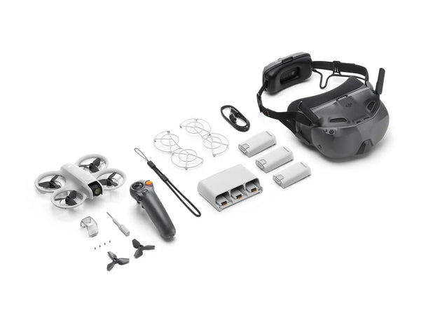 DJI Neo Motion Fly More Combo with drone, controller, batteries, and headset components arranged on a surface.