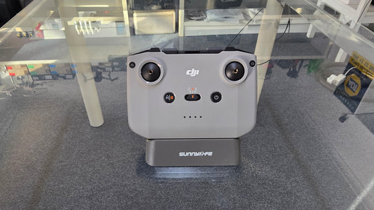 Pre-Owned DJI RC N3 Controller displayed on a stand, showing controls and connectivity options, ideal for DJI drone models.