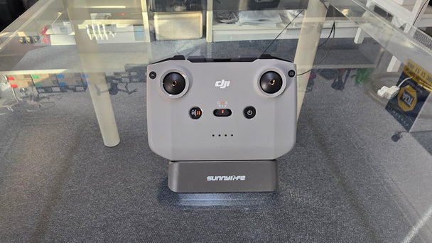 Pre-Owned DJI RC N3 Controller displayed on a stand, showing controls and connectivity options, ideal for DJI drone models.
